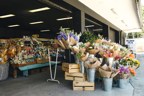 Fresh flower bunches for sale outside Tarragindi Good Things Grocer.